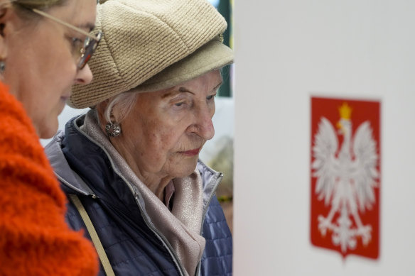 A woman prepares her ballot on Sunday. Poland held an election on Sunday that many see as its most important one since the 1989 vote that toppled communism.